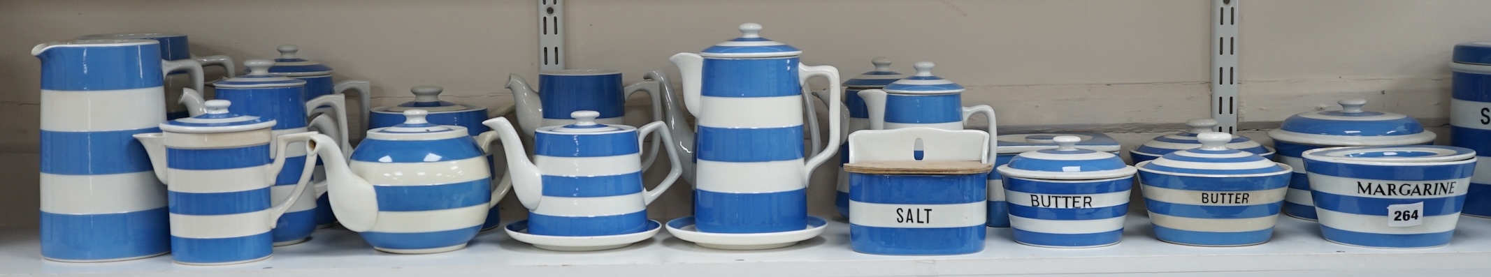 T.G.Green Cornish Kitchenware, eleven tea, coffee and hot water pots, two jugs, a salt pot, five Butter, Lard and Margarine lidded jars and one unnamed square jar, largest 20cm high, mixed marks. Condition - poor, fair a